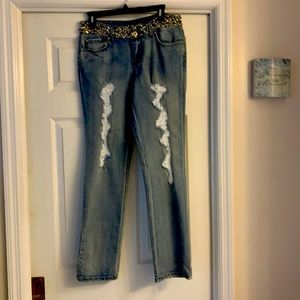 A pair of jeans with an ornate waist.